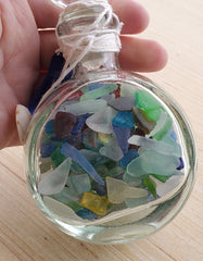 SET OF 2 BOTTLES OF SEA GLASS AS SHOWN