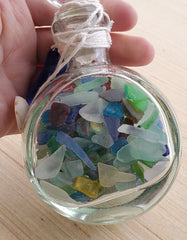 SET OF 2 BOTTLES OF SEA GLASS AS SHOWN