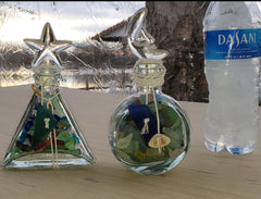 SET OF 2 BOTTLES OF SEA GLASS AS SHOWN